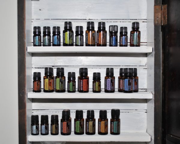 Repurposed Piano Bench Turned Essential Oil Cabinet - doterra